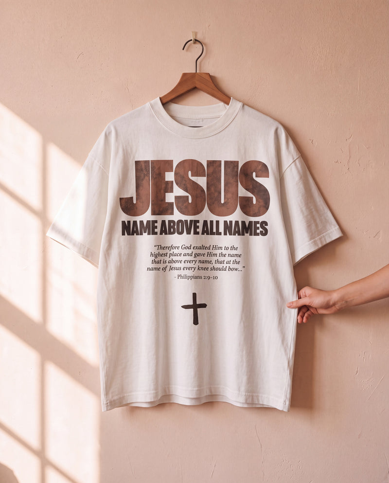 Jesus Name Above All Names white tee on a hanger, front print