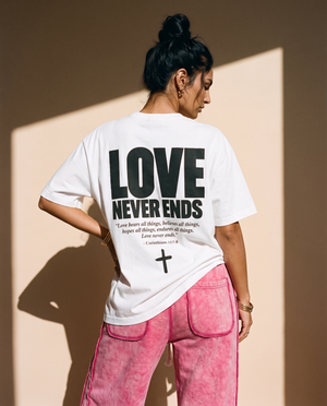Love Never Ends tee, white, back print edition, woman, back print hand on hip