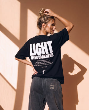 Light Over Darkness tee, black, back print edition, woman, back print hand in hair look over