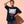 Light Over Darkness tee, black, front print, woman, hand in hair thigh up