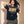 Jesus the Way the Truth the Life faded black tee, front print, woman with curly hair lifting both hands to her hair, worn with camo pants