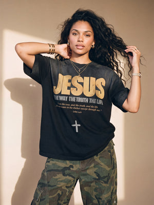 Jesus the Way the Truth the Life faded black tee, front print, woman with curly hair lifting both hands to her hair, worn with camo pants