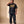 Jesus the Way the Truth the Life faded black tee, full body view of a man with a hand behind his neck in matching sweatpants and sneakers