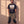 King of Kings faded black tee, full body view of a bearded man in camo cargo pants and work boots, Christian streetwear look