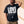 Love Never Ends tee, black, front print, man, hand behind head thigh up