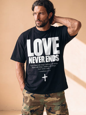 Love Never Ends tee, black, front print, man, hand behind head thigh up
