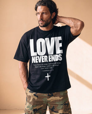Love Never Ends tee, black, front print, man, hand behind head thigh up