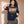 Jesus the Way the Truth the Life faded black tee, woman with one hand by her ear and one in her pocket, Christian streetwear with camo pants