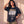 Heart of a Lion faded black tee, front print, woman leaning on a wall with a hand in her hair and one at the hem, Christian streetwear
