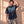 Pray Until Something Happens faded black tee, man with a hand in his hair, thigh up, the John 14:13–14 verse and cross in view