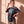 Pray Until Something Happens faded black tee, three quarter angle on a woman with a hand by her hair and one on her hip, boxy fit