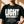 Light Over Darkness tee, black, front print, woman, chest close up