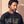 Heart Wide Open faded black tee, close up portrait of a man with a beard looking down above the large HEART lettering