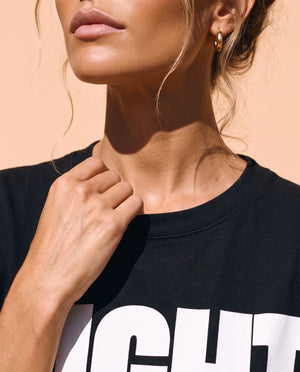 Light Over Darkness tee, black, front print, woman, collar close up
