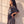 In the Beginning God faded black tee, side profile of a woman with a hand on her hip, showing the dropped shoulder and relaxed length