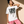 Love Never Ends tee, white, front print, woman, leaning on wall thigh up