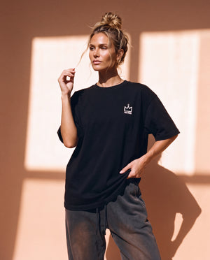 Light Over Darkness tee, black, back print edition, woman, front crown thigh up