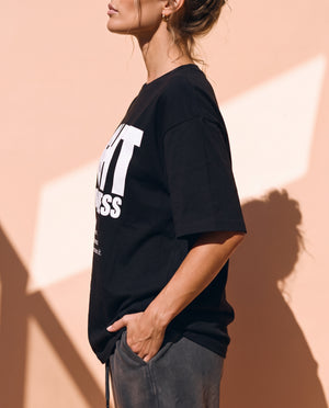 Light Over Darkness tee, black, front print, woman, side profile thigh up
