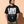 Love Never Ends tee, black, front print, man, three quarter thigh up