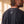 Heart of a Lion faded black tee, close up of the back neckline on a man, crown logo and THE WORD below the ribbed collar