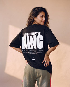 Daughter of the King tee, black, back print edition, woman, back print look over thigh up