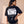 Daughter of the King tee, black, back print edition, woman, back print look away waist up