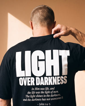 Light Over Darkness tee, black, back print edition, man, back print collar grip close up