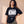 Daughter of the King tee, black, front print, woman, hand on hip thigh up