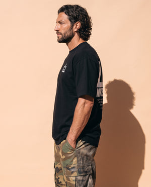 Love Never Ends tee, black, back print edition, man, front crown side profile thigh up