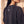 Daughter of the King faded black tee, close up of the back neckline on a woman, crown logo and THE WORD below the ribbed collar