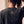 Heart Wide Open faded black tee, close up of the back neckline on a woman, crown logo and THE WORD below the ribbed collar