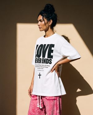 Love Never Ends tee, white, front print, woman, side profile thigh up