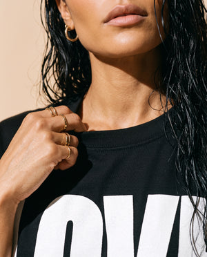 Love Never Ends tee, black, front print, woman, collar close up