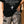 Love Never Ends tee, black, back print edition, woman, back print hand on hip close up