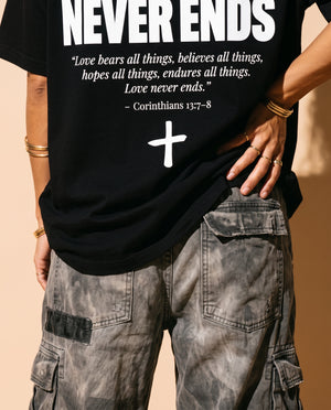 Love Never Ends tee, black, back print edition, woman, back print hand on hip close up