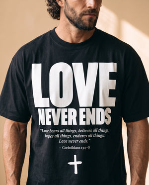 Love Never Ends tee, black, front print, man, chest close up
