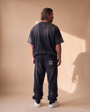 Jesus the Way the Truth the Life faded black tee, back view of a man in matching sweatpants, crown logo below the collar and on the pocket