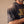 Jesus the Way the Truth the Life faded black tee, close up on a man's shoulder and chest, the sunfaded sleeve and the JESUS lettering