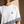 Love Never Ends tee, white, back print edition, woman, front crown chest close up