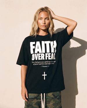 Faith Over Fear tee, black, front print, woman, hand in hair thigh up