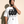 In The Beginning God tee, white, front print, man, hand on collar thigh up