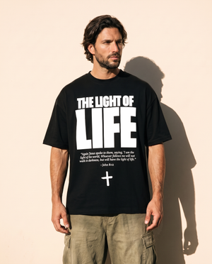 The Light of Life tee, black, front print, man, look away thigh up