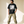 The Light of Life tee, black, front print, man, hand on hem full body