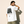 The Light of Life tee, white, back print edition, man, back print hand in hair