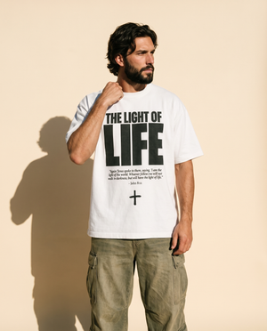 The Light of Life tee, white, front print, man, hand on collar waist up