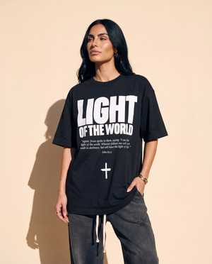 Light of the World tee, black, front print, woman, standing thigh up