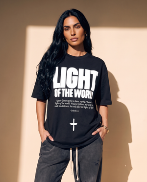 Light of the World tee, black, front print, woman, three quarter thigh up