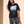 Light of the World tee, black, front print, woman, leaning on wall full body