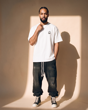 Light of the World tee, white, back print edition, man, front crown hand on collar full body