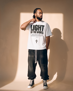 Light of the World tee, white, front print, man, hand on collar thigh up